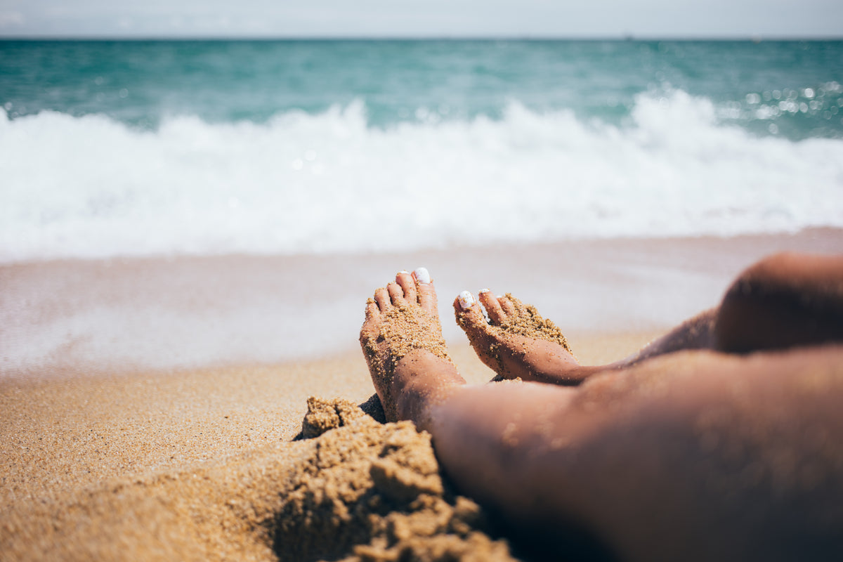 sandy-feet on a beach 